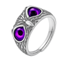Silver ring with purple gemstones on a white background