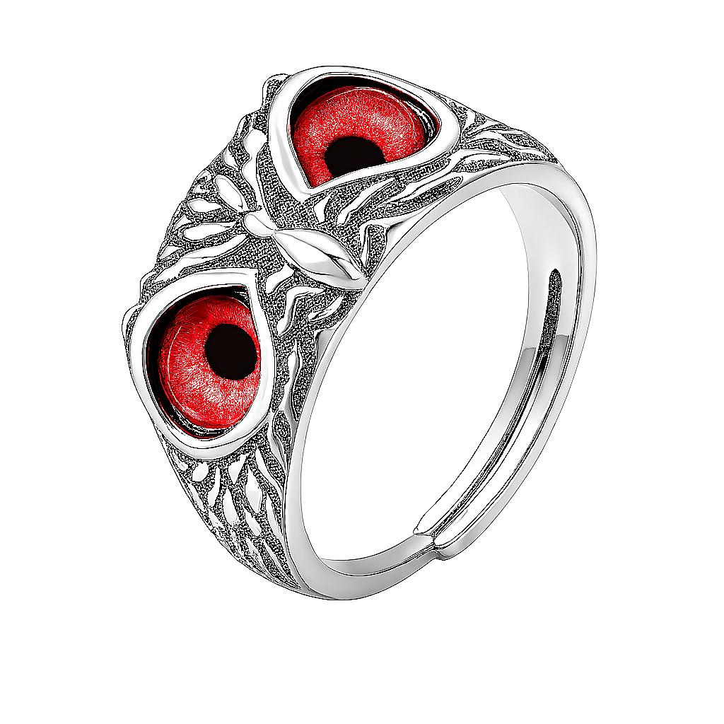 Silver ring with red gemstones on a white background